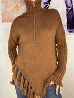 loose fit poncho with high neck and hanging frings